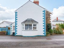 A house with a bay window and fence at Cubbs Corner in Goonbell near St Agnes