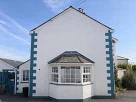 A house exterior with windows and a fence at Cubs Corner in St Agnes