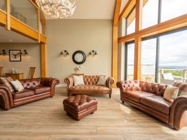 A living room with three sofas and a coffee table at Valley View Lodge 1 Preston