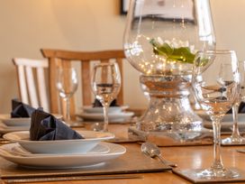 A dining room with a set table at Valley View Lodge 1 Preston