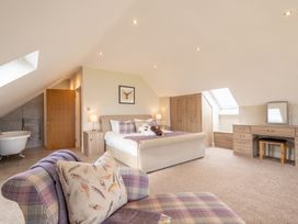 A bedroom with a bed and bathtub at Valley View Lodge 1 Preston