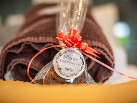 A towel with a wrapped cake and gift tag at Valley View Lodge 1 Preston