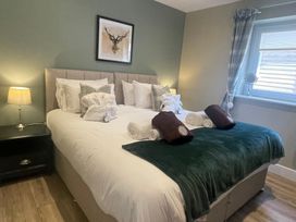 A bedroom with a bed and bedside table at Valley View Lodge 1 Preston