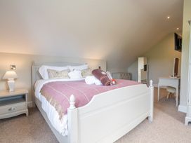 A bedroom with a bed and nightstand at Valley View Lodge 1 Preston