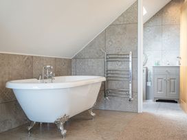 A bathroom with a bathtub and sink at Valley View Lodge 1 in Preston