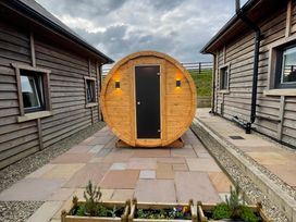 A wooden cabin structure in the outdoor area at Valley View Lodge 1 Preston