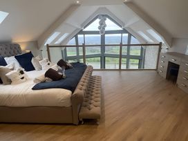 A bedroom with a bed and view at Pendle View in Preston