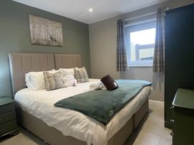 A bedroom with a bed and pillows at Pendle View in Preston