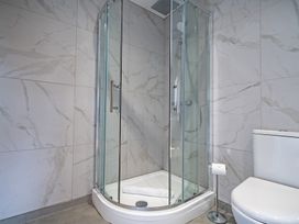 A bathroom with a shower and a toilet at Pendle View in Preston