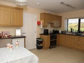 A kitchen with cabinets and appliances at The Farmhouse in Omagh