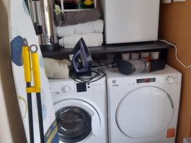 A laundry room with a washing machine and dryer at The Farmhouse in Omagh