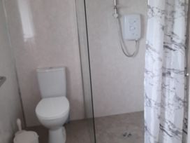 A bathroom with a shower and toilet at The Farmhouse in Omagh