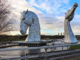 Two horse sculptures near water at Beechtree Lodge 54 Denny