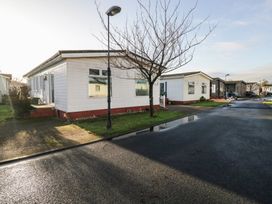 A mobile home in a residential area at Beechtree Lodge 57 Denny