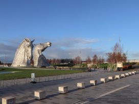 A sculpture of two horses in a park at Beechtree Timber Lodge 69A Denny