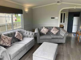 A living room with two sofas and a coffee table at Caravan 38 in Newport