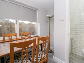 A dining room with a table and chairs at Mables in Wigton