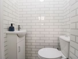 A bathroom with a sink and toilet at Mables in Wigton