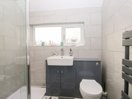 A bathroom with a shower, sink, and toilet at Mables in Wigton