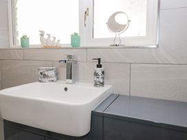 A bathroom with a sink and faucet at Mables in Wigton
