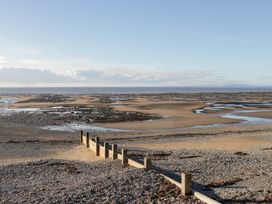 A beach with sand and water at Mables in Wigton