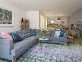 A living room with a grey sofa and coffee table at Villa 8, Estura in Salcombe