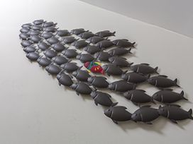 A group of decorative fish arranged in a pattern indoors at Villa 8, Estura in Salcombe