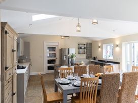 A kitchen with dining table and chairs at 6 Front Street