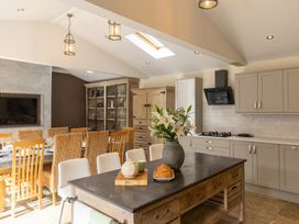 A kitchen with a table and chairs at 6 Front Street 