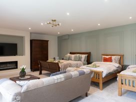 A bedroom with multiple beds and furniture at 6 Front Street 