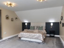 A bedroom with a bed and bedside table at 6 Front Street