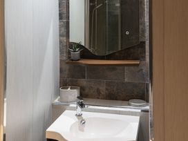 A bathroom with a sink and mirror at 6 Front Street