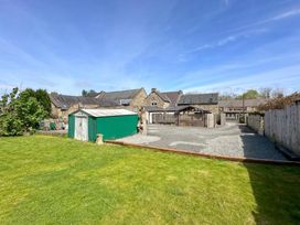 An outdoor area with a shed and barn at 6 Front Street in 