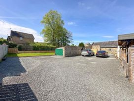An outdoor parking area with gravel and trees at The Old Sawmill in Burnopfield