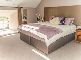 A bedroom with a bed and bedside table at The Granary in Durham