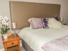 A bedroom with a bed and nightstand at The Granary in Durham