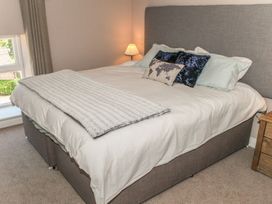 A bedroom with a bed and lamp at The Granary in Durham