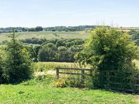 A view of a field and trees in the countryside at The Granary in Durham