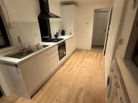 A kitchen with a sink and stove in Cabin 1 Moffat Manor Moffat