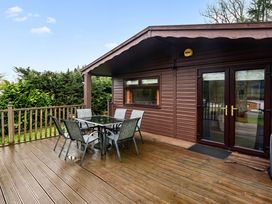 An outdoor area with a table and chairs at Cabin 1 Moffat Manor Beaufort