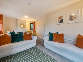 A living room with sofas and a table at Cabin 1 Moffat Manor in Beaufort