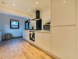 A kitchen with appliances and a window at Cabin 1 Moffat Manor Beaufort