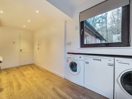 A laundry room with washing machine and dryer at Cabin 1 Moffat Manor Beaufort