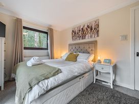 A bedroom with a bed and nightstand at Cabin 1 Moffat Manor in Beaufort