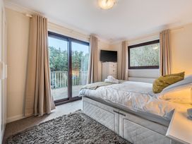 A bedroom with a bed and television at Cabin 1 Moffat Manor, Beaufort