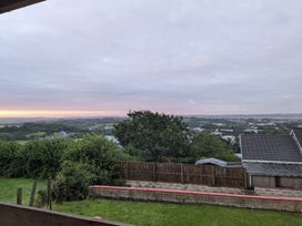 A view of the landscape and sky at The Retreat Cabin in Llanelli