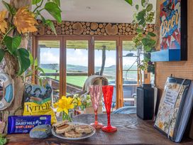 A table with food and drinks at The Retreat Cabin in Llanelli