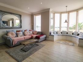 A living room with a sofa and coffee table at Cootiya Corner in Great Lyth