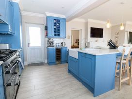 A kitchen with cabinets and a sink at Cootiya Corner in Great Lyth