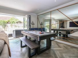 A games room with a pool table and outdoor area at Cootiya Corner in Great Lyth